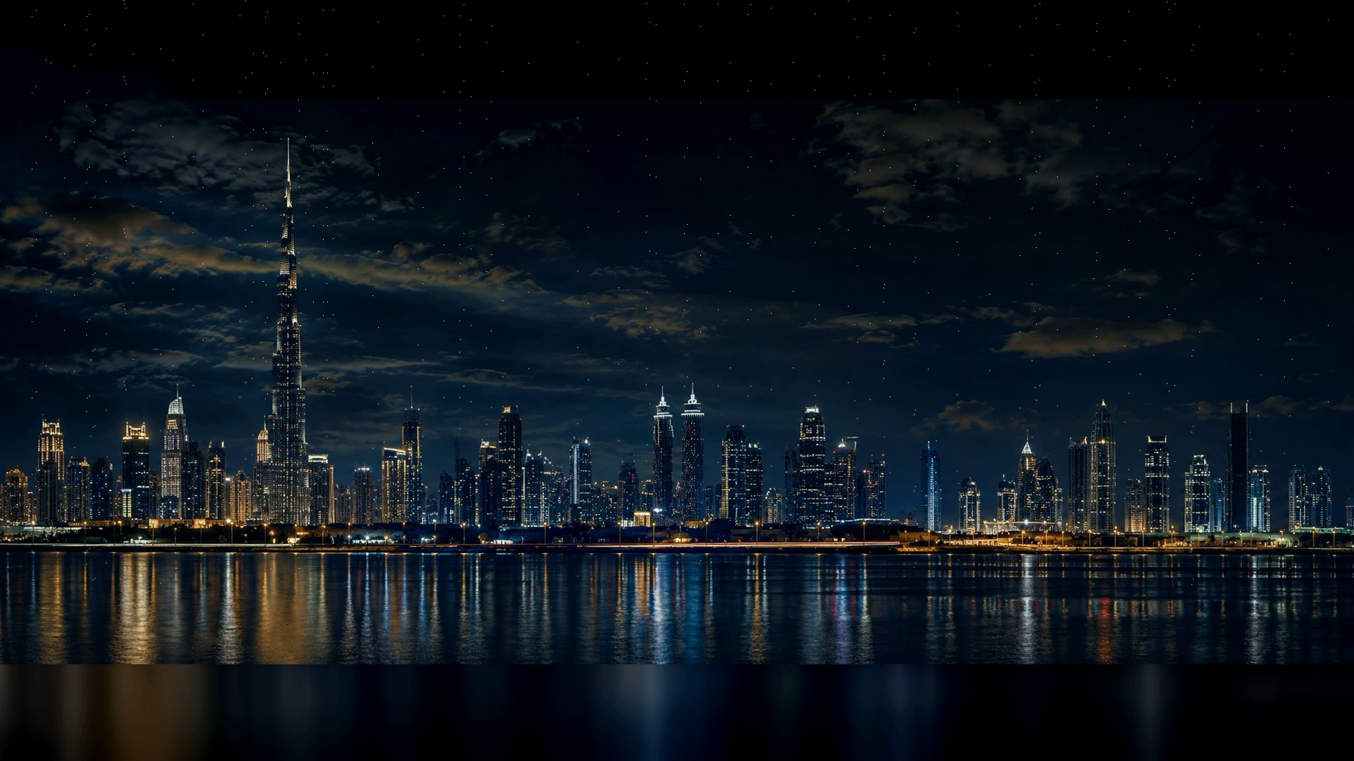 Dubai skyline at night, Burj Khalifa lit above Downtown Dubai